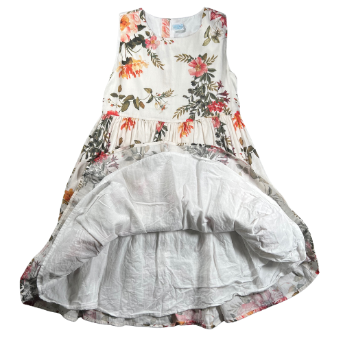 Pre-owned Edgehill Collection floral dress for little girls in size 6X. Features an off-white color with warm floral patterns, sleeveless design, ruffle hem, and back zipper closure. Made from 100% cotton with a fully attached liner. Gently used and in very good condition. Shop online at ourfamiliesattic.com