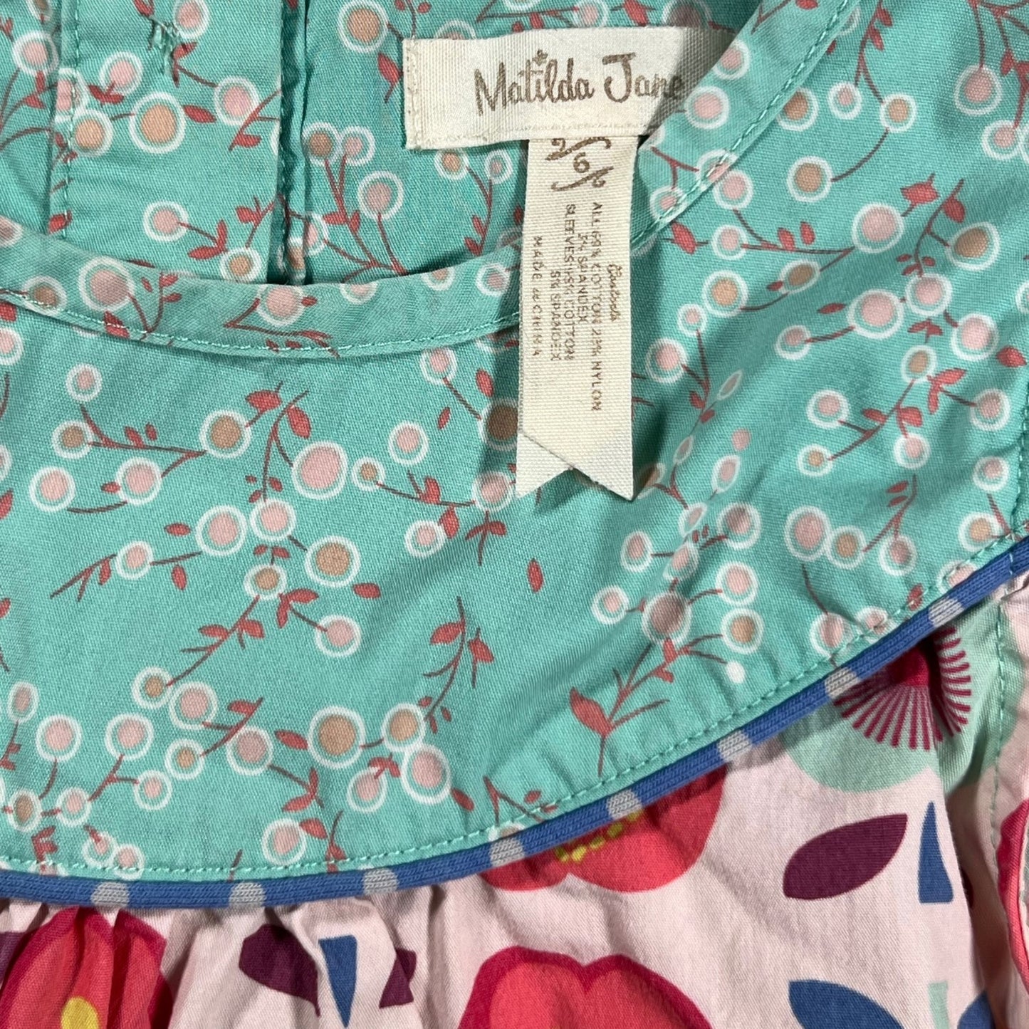 Apple and floral print detail on Matilda Jane girls top, size 6 with label, pre-owned at Our Families Attic.