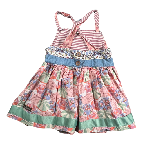 Pre-owned Matilda Jane Parasol Knot Top for girls, size 6, featuring a light multicolor design of pink, green, and blue, with a charming knot detail, decorative buttons, and crisscross straps, available at Our Families Attic.
