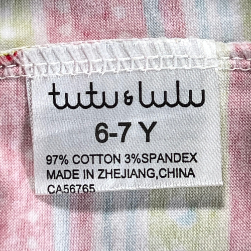 Pre-Owned colorful striped ruffled pants for girls, size 6-7 Y, by Tutu & Lulu, available at Our Families Attic. Features an elastic waist, ruffles on the hem, and playful prints of polka dots, stripes, and birds. Excellent used condition, perfect for playful outings.