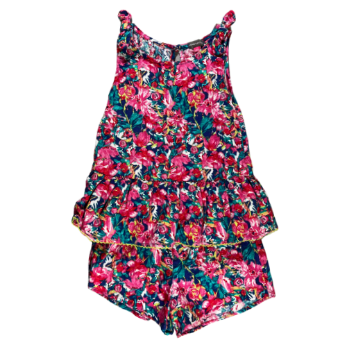 Pre-Owned 2 Piece Top and Shorts Bright Floral Set Brand: Vince Camuto Size: Big Girl 7 Color: Bright pink and blue floral Features: Sleeveless with 1" shoulder, bow on shoulders, button closure on back of the top, elastic waist shorts. Material: 55% Linen, 45% Rayon Condition: Excellent used. Online thrift store - Our Families Attic