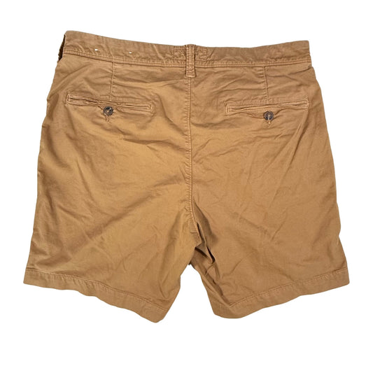 Tan chino style shorts back view with welt pockets