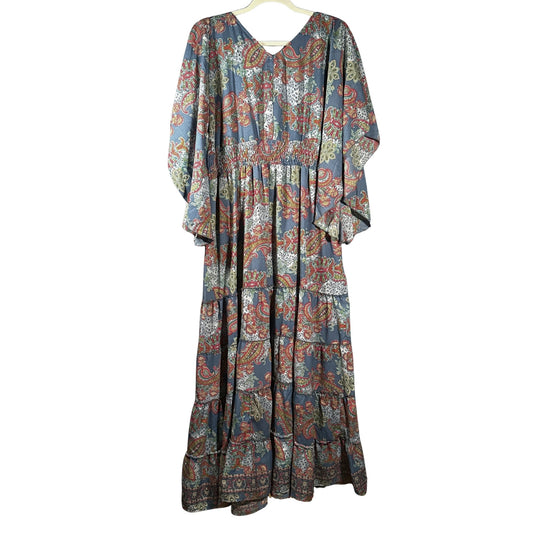 Back view of Boemo women's large blue-gray paisley floral maxi dress showing the long flowing skirt, smocked waist, and loose sleeves.