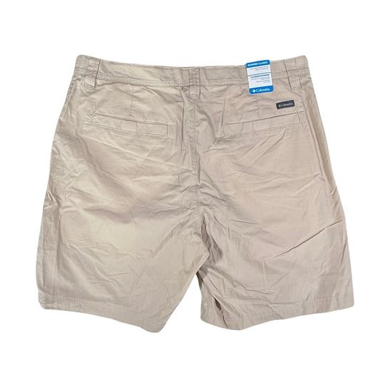 Beige shorts with Columbia branding on a white background