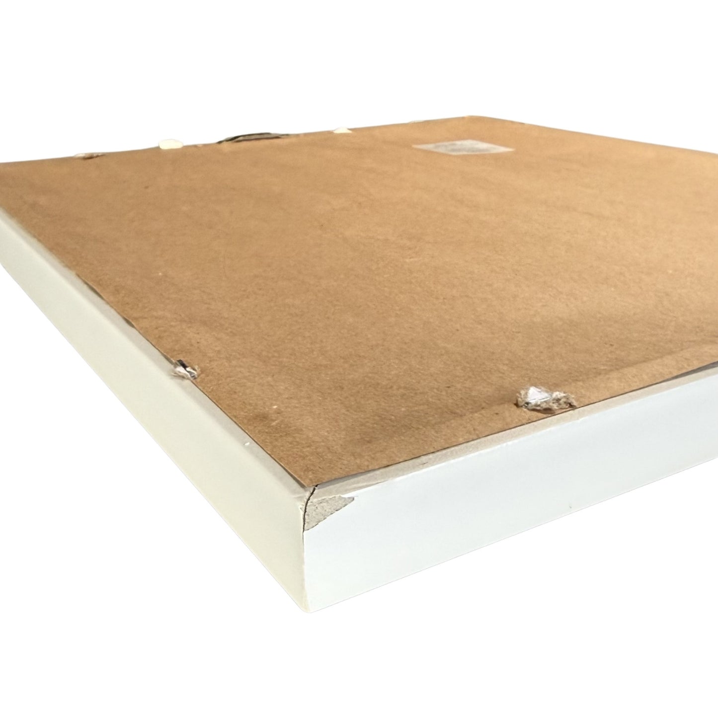 Close up of small chip on back corner of white frame