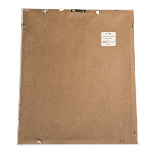 Back of framed macaron wall art showing white frame and hanging hardware