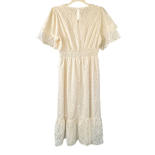 Back view of SHEIN cream textured midi dress showing layered sleeves, smocked waist, ruffled hem, and small keyhole opening at neckline.