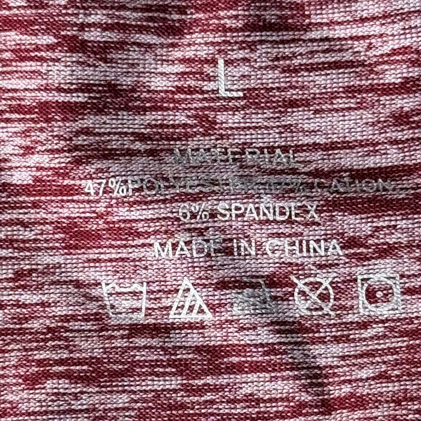 Tag showing size large on women's heather red gray performance athletic shirt