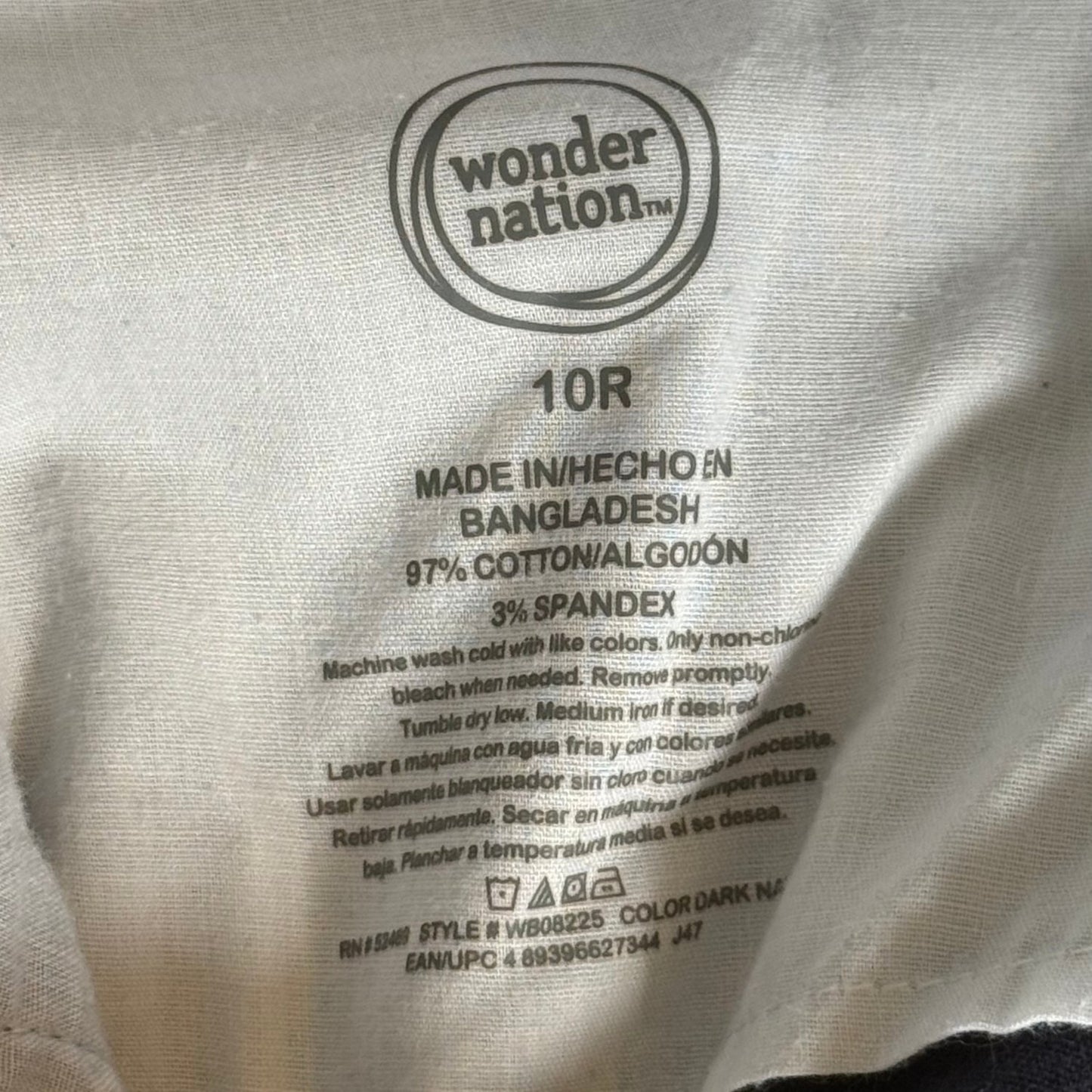Wonder Nation boys size 10R brand and material tag showing 97% cotton and 3% spandex