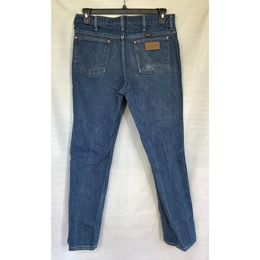 Back view of blue Wrangler men’s jeans with W-stitched pockets and wear on the right pocket