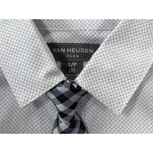 Van Heusen Long Sleeve Button-Up Dress Shirt with Clip-On Tie ( Retail Price $40.00 ) Size: Big Boy Small ( 8 ) Regular Color: White with purple/lavender sprinkles Features: Flex Long Sleeve Button-up Button cuffs Collar Clip-On tie Spare Buttons Material: 97% Polyester, 3% Spandex Condition: NWT New front - Our Families Attic