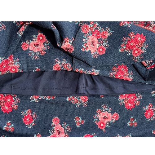 Midnight Doll Dark Blue & Pink Floral Bare Shoulder Dress (Est. Orig. Retail Price $79.00) Size: Junior's size 3 Color: Dark blue with pink floral print Features: Back Zip Sleeveless Bare shoulder Rounded high-neck collar A-line Side slits on both sides of the skirt Short slip underneath Material: Outer shell: 96% Polyester, 4% Spandex Liner: 100% Polyester Condition: Excellent Used Condition slip - Our Families Attic