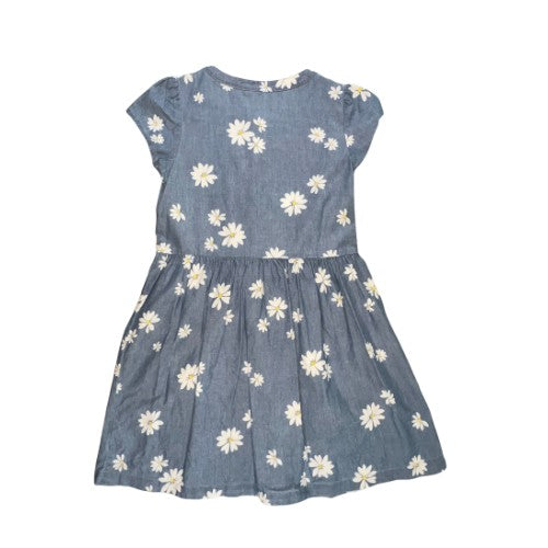 Pre-Owned Blue Denim-Look Dress  Brand: Carter's Kid Size: Little Girl 6-6x Color: Light blue (denim look) with white daisy print Features: Cap sleeve, lightweight, front top button closure, tie in front Material: 100% Cotton Condition:   Gently used. There are a couple of very small snags on the front of the skirt. Used clothes. Our Families Attic.