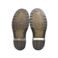 Bottom of Dr. Martens 1460 tie-dye boots showing tread and minimal wear