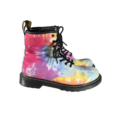 Side view of Dr. Martens 1460 tie-dye boots showing yellow stitching and 8-eye laces