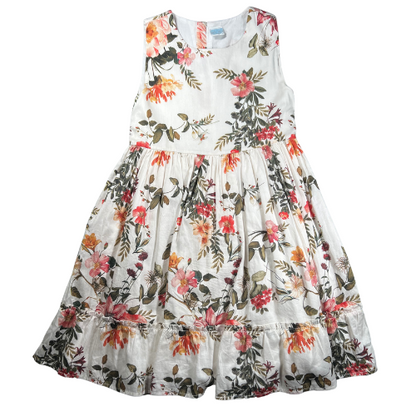 Pre-owned Edgehill Collection floral dress for little girls in size 6X. Features an off-white color with warm floral patterns, sleeveless design, ruffle hem, and back zipper closure. Made from 100% cotton with a fully attached liner. Gently used and in very good condition. Shop online at ourfamiliesattic.com