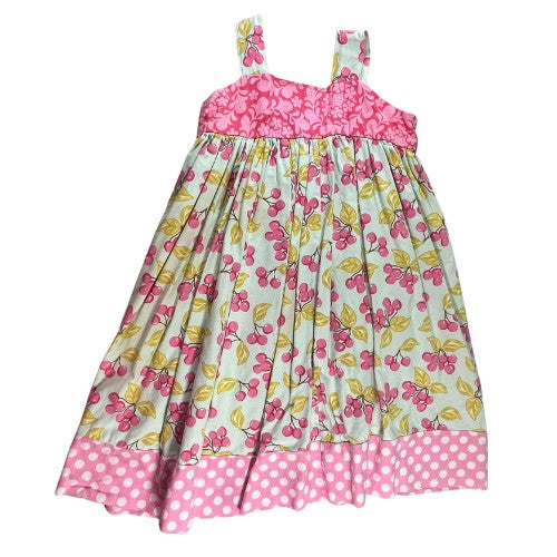 Pre-Owned Pink and White Polka Dot Dress Brand: Heather Hill Size: Little Girl 6 (an estimate on size) Color: Pink, white, and green with polka dots, cherries, apple, and floral print. Features: Sleeveless, 1.5" shoulder strap, cute knot on the straps, small apron, wide hem Material:  Cotton Condition:  Good,  Gently used. There is a small mark on the back at the hem. Used clothing. Our Families Attic