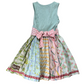 Multicolored dress with a patterned skirt and light blue top on a white background