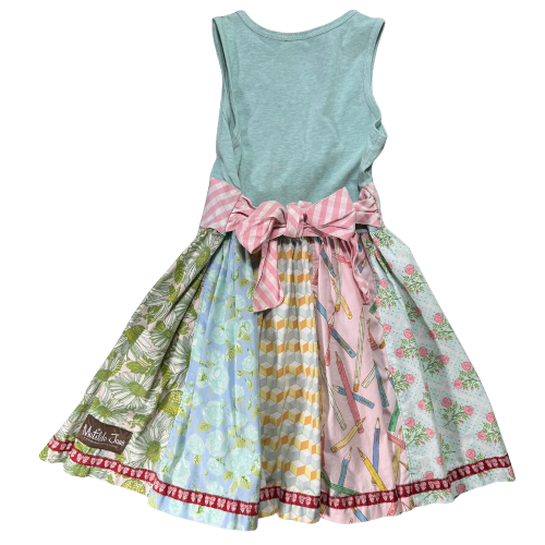 Multicolored dress with a patterned skirt and light blue top on a white background