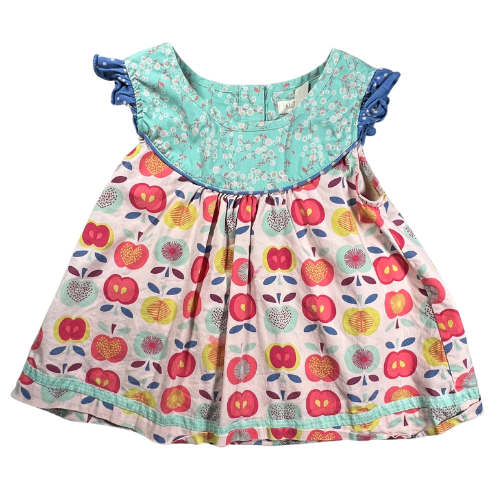 Pre-owned Matilda Jane Lucia Shabby Apple Top for little girls, size 6, featuring a light multicolor design with apple and floral prints, cap ruffle sleeves, button closure at the back, and ribbon trim, available at Our Families Attic.