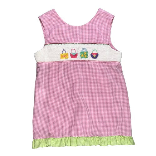 Pre-Owned Smocked Top and Pants Set Brand: Mom & Me Size: Little girl 6X Color: Pink and white gingham with embroidered purses/bags, and green gingham checkered Features: Sleeveless, 2" shoulder, smocking and embroidery on the top, ruffle trim, 2-button foldover back, elastic waist Material: 65% Cotton, 35% Polyester Condition:  Excellent Used. Online thrift store - Our Families Attic