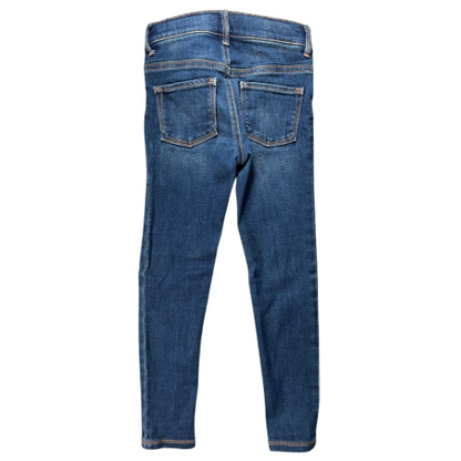 Pre-owned Old Navy Rockstar Jeggings for little girls in size 6. Dark wash denim with an adjustable waist, belt loops, two back pockets, faux front pockets, and a zipper with snap closure. Made from a blend of cotton, polyester, spandex, and other materials. Very good, gently used condition. Shop www.ourfamiliesattic.com