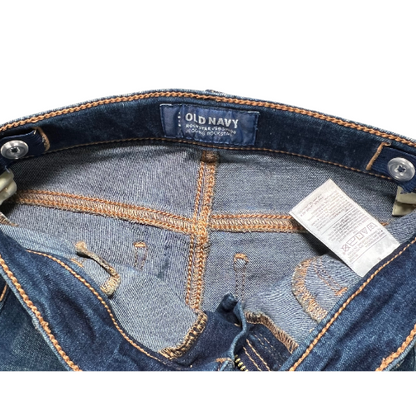 Pre-owned Old Navy Rockstar Jeggings for little girls in size 6. Dark wash denim with an adjustable waist, belt loops, two back pockets, faux front pockets, and a zipper with snap closure. Made from a blend of cotton, polyester, spandex, and other materials. Very good, gently used condition. Shop www.ourfamiliesattic.com