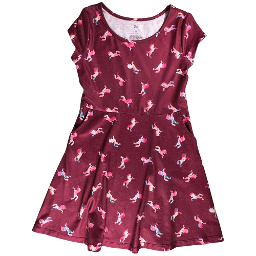 Pre-Owned dark red unicorn print dress for big girls, size 7, by SO, available at Our Families Attic. Features colorful unicorn patterns, cap sleeves, and pockets in the skirt. Gently used and perfect for playful occasions.