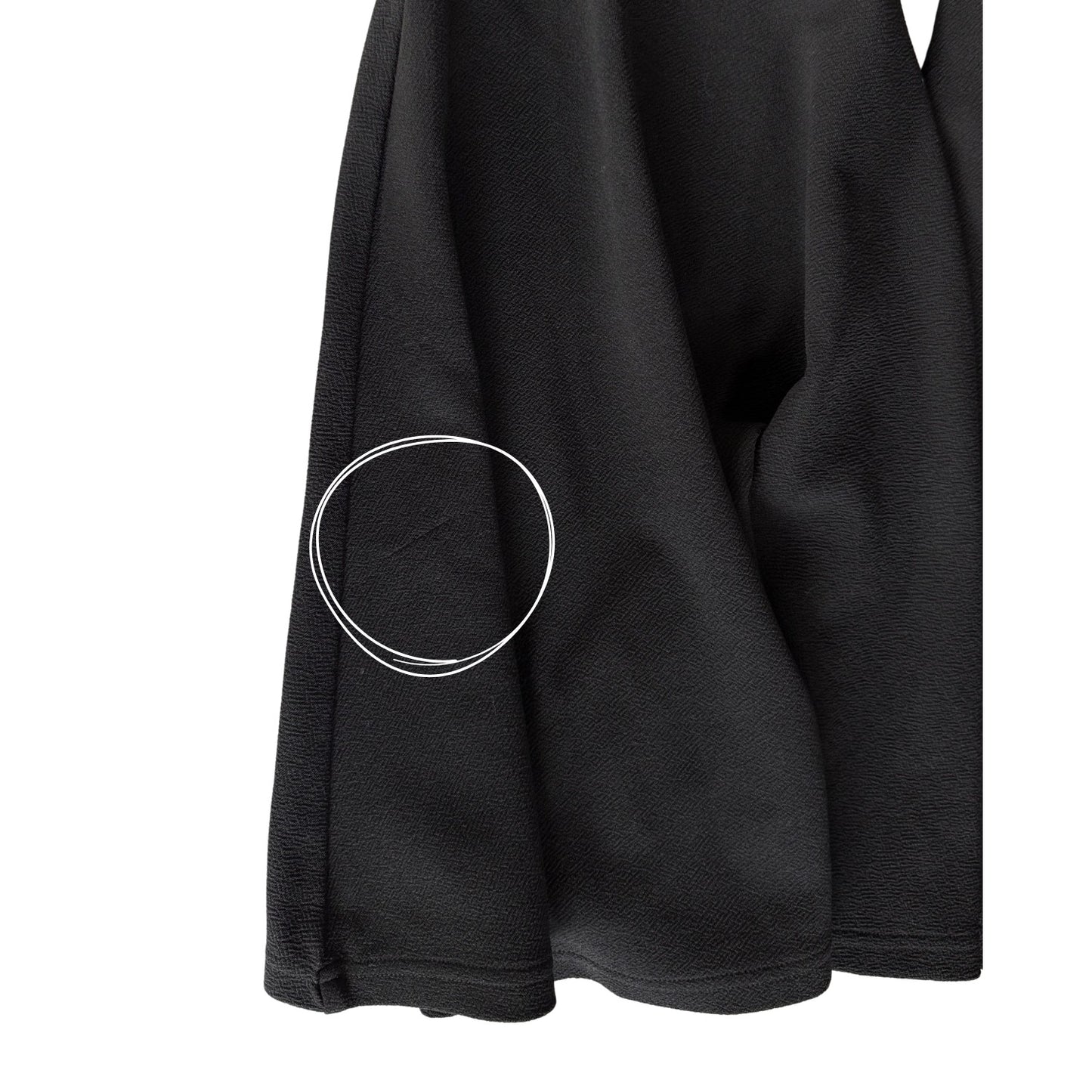 Close-up of small snag on lower back left flare of SHEIN black flare pants women’s XL