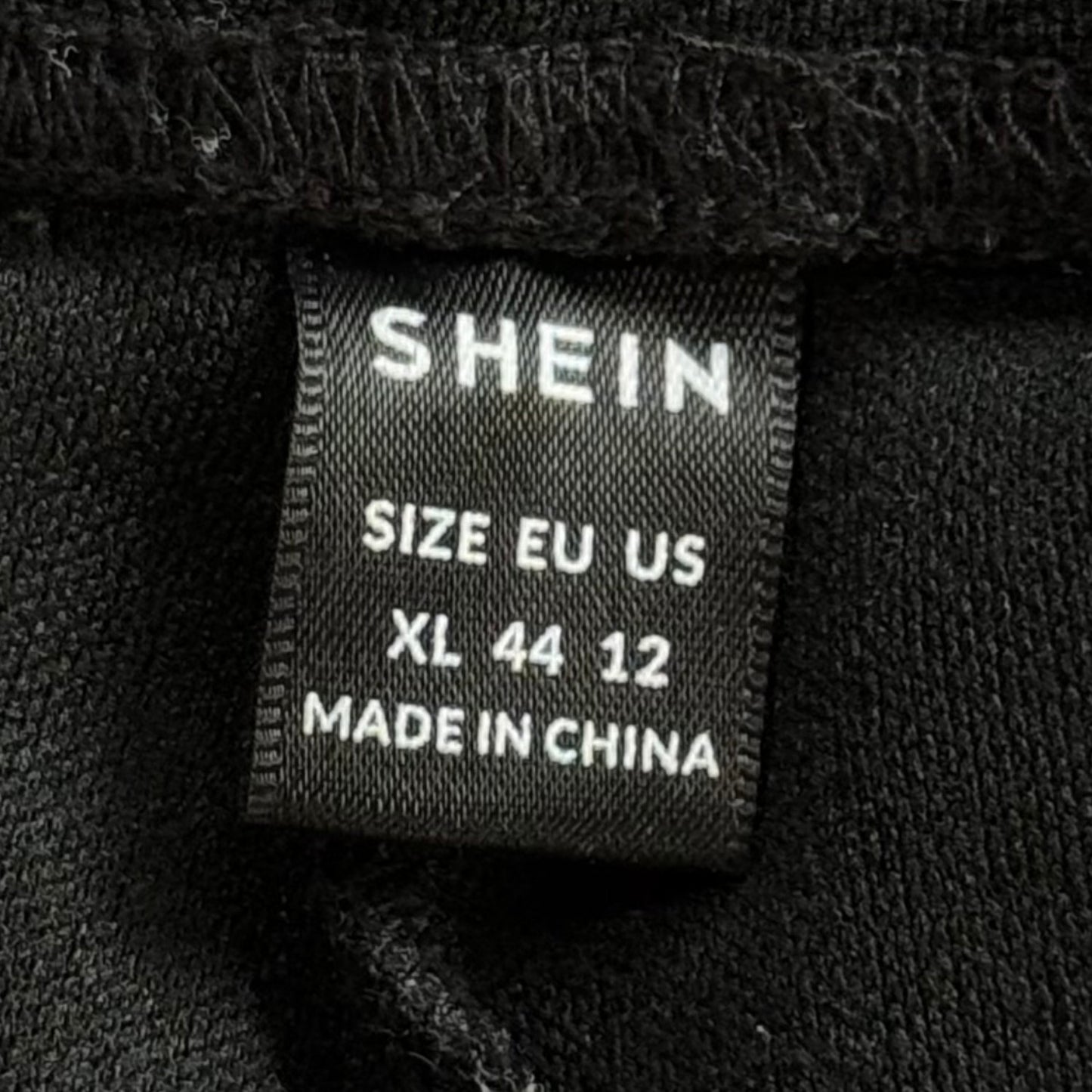 SHEIN women’s XL clothing tag 99% polyester 1% elastane