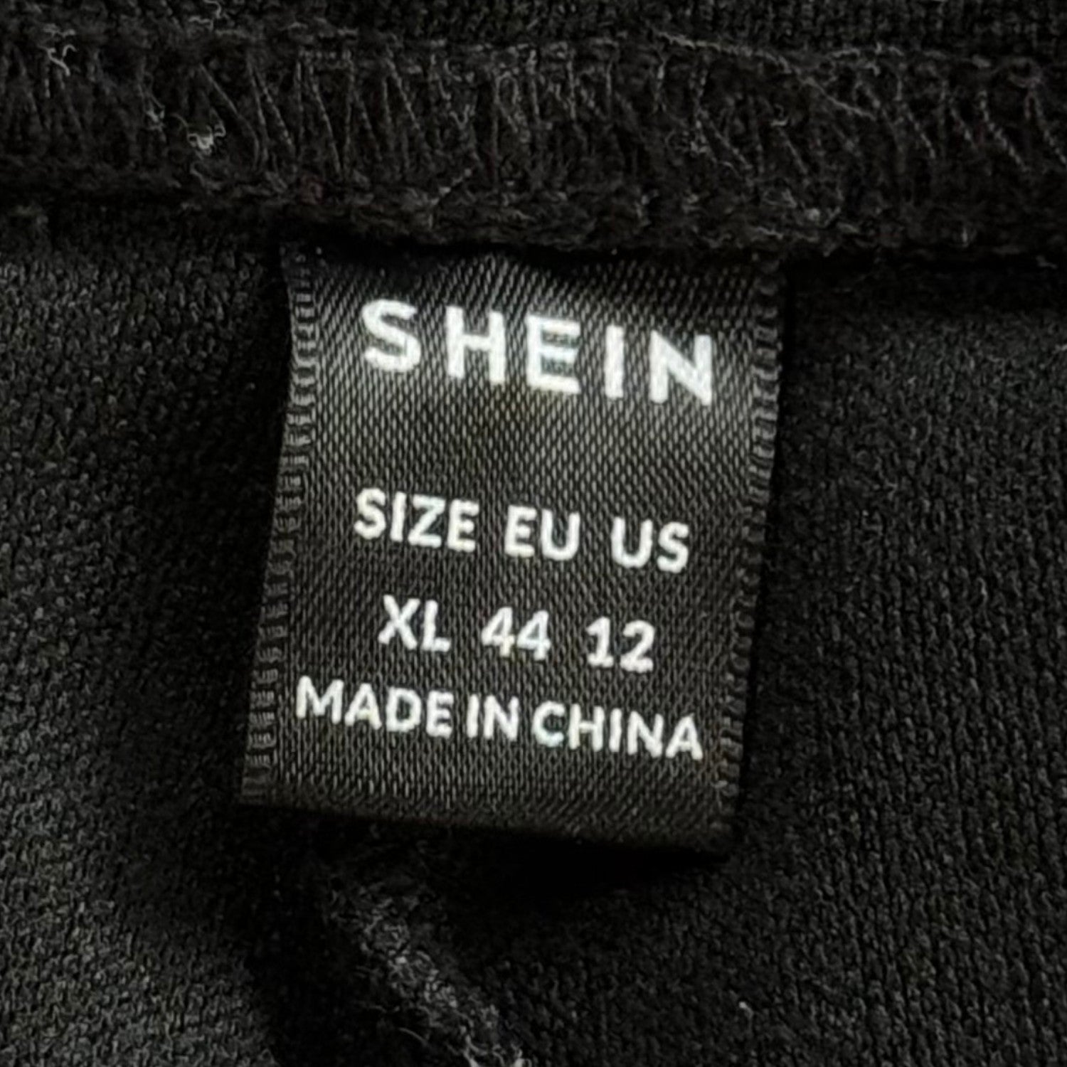 SHEIN women’s XL clothing tag 99% polyester 1% elastane