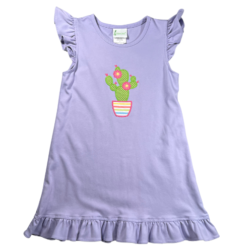 Pre-Owned Zuccini purple dress for little girls, size 6, featuring a cactus applique, ruffle cap sleeves, and a ruffled hem. Available at Our Families Attic, gently used with a minor stain above the hem. Perfect for sunny days!