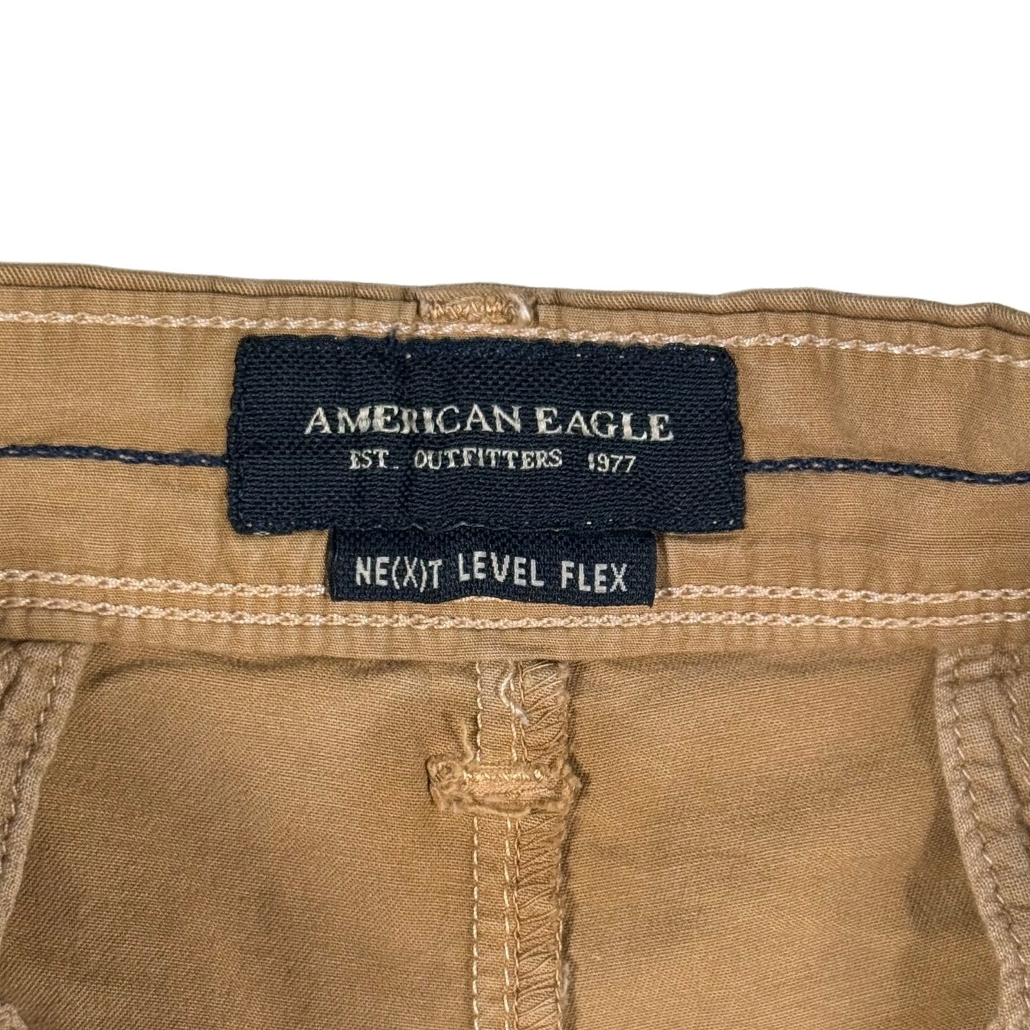Close-up of American Eagle label on beige pants