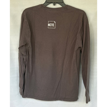 Back of Gildan adult medium charcoal-gray long-sleeve graphic shirt with small NCTE logo