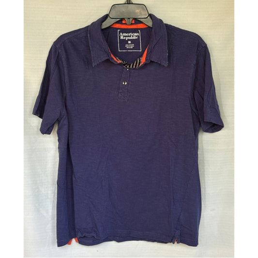 Front of American Republic men’s medium navy blue short-sleeve cotton polo with orange and striped placket accents
