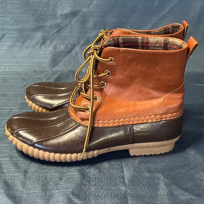 Side profiles of brown ANNA lace-up duck boots with dark brown rubber bottoms and tan soles.