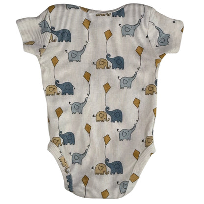 Baby onesie with elephant pattern on a cream background back view