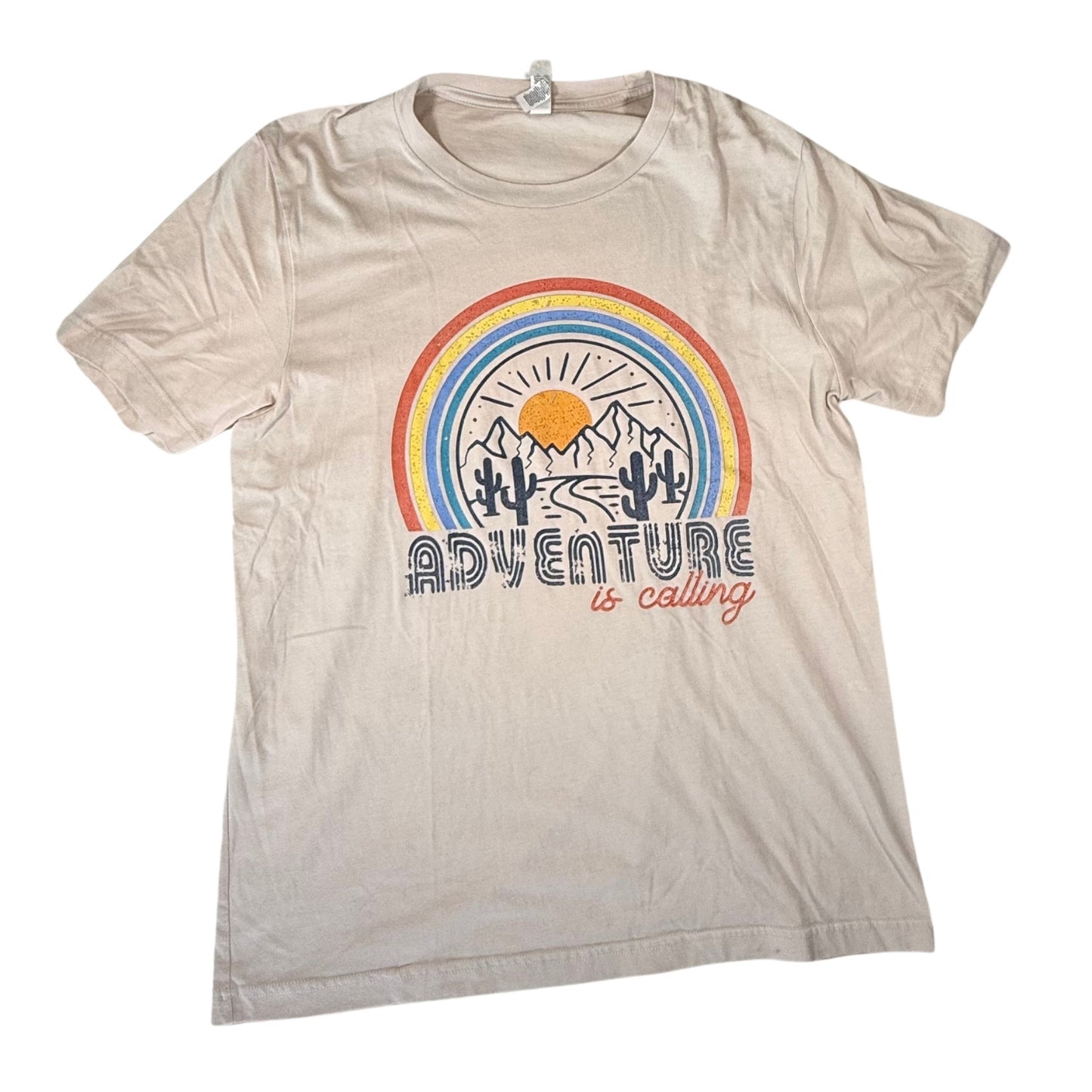Beige graphic t-shirt with rainbow desert Adventure is Calling design front view