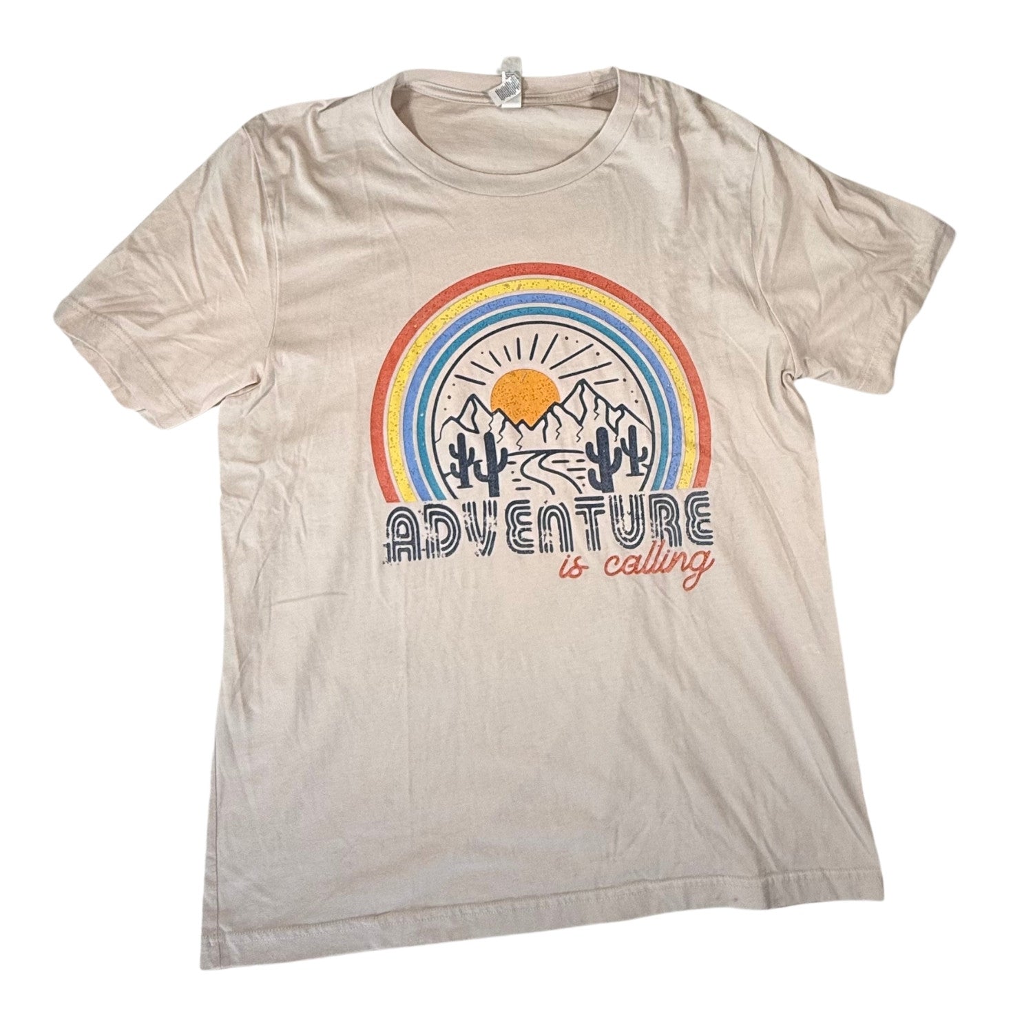 Beige graphic t-shirt with rainbow desert Adventure is Calling design front view