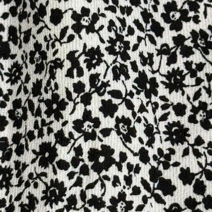 Womens black and white floral 2 piece set crop top and skirt close up detail