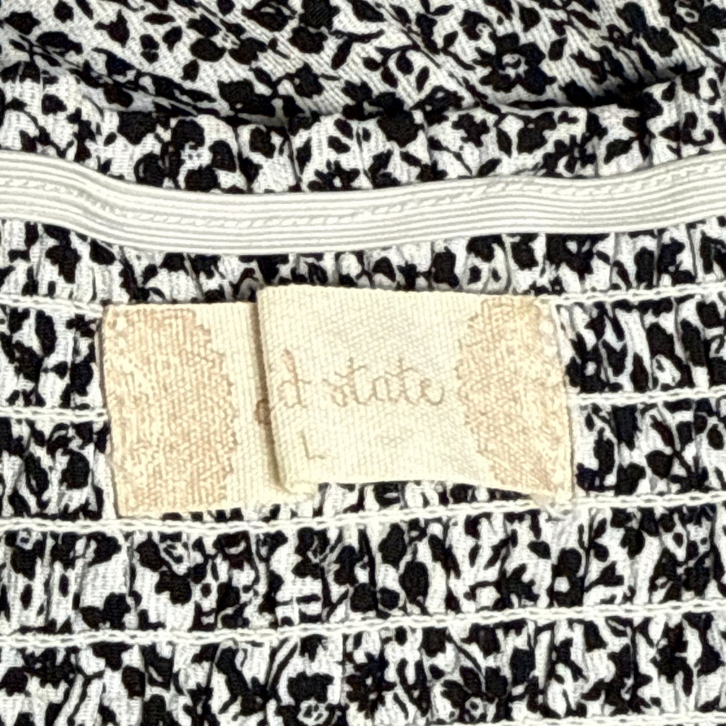 Ruffled skirt and smocked waistband large tag