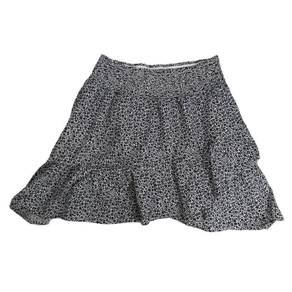 Ruffled skirt and smocked waistband detail