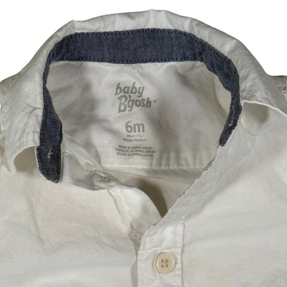 Blue jean trim on collar and wrist of baby onesie tag