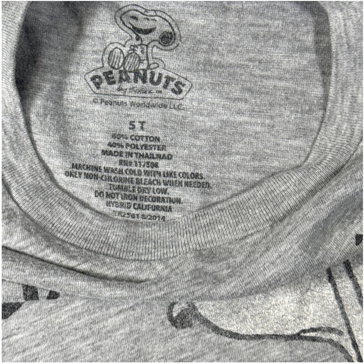 Printed Peanuts size 5T, 60% cotton, and 40% polyester label inside the Halloween shirt.