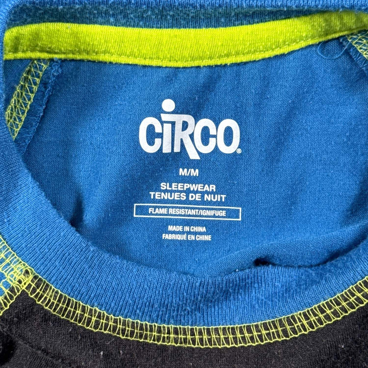 Circo boys pajama top tag showing size M/M and flame-resistant sleepwear labeling