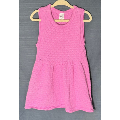Front view of Carter's pink textured knit sweater dress for baby girls, size 18 months, with round neckline and gathered skirt.