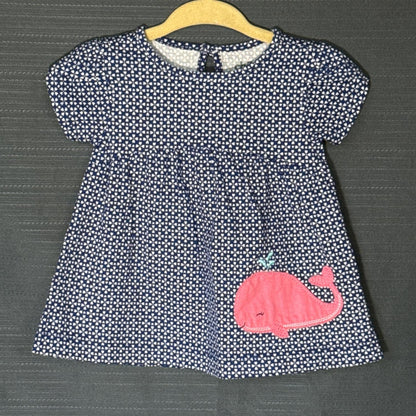 Front view of Carter's Child of Mine baby girls dress with navy blue and white heart print, gathered skirt, and pink whale appliqué.