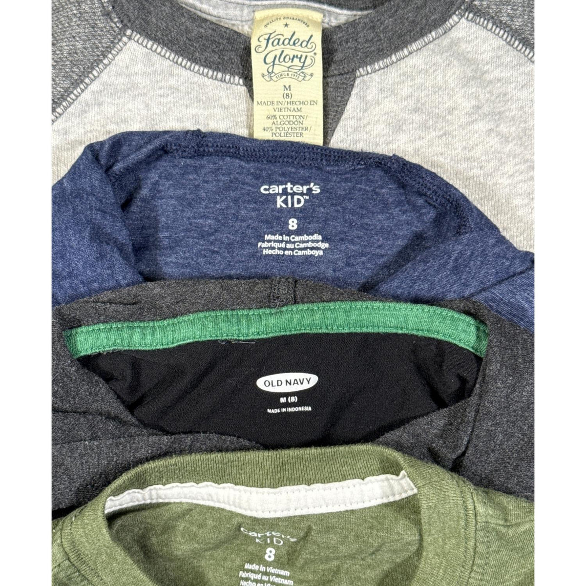 Size and brand labels on boys size 8 clothing bundle showing Faded Glory, Carter’s Kid, and Old Navy