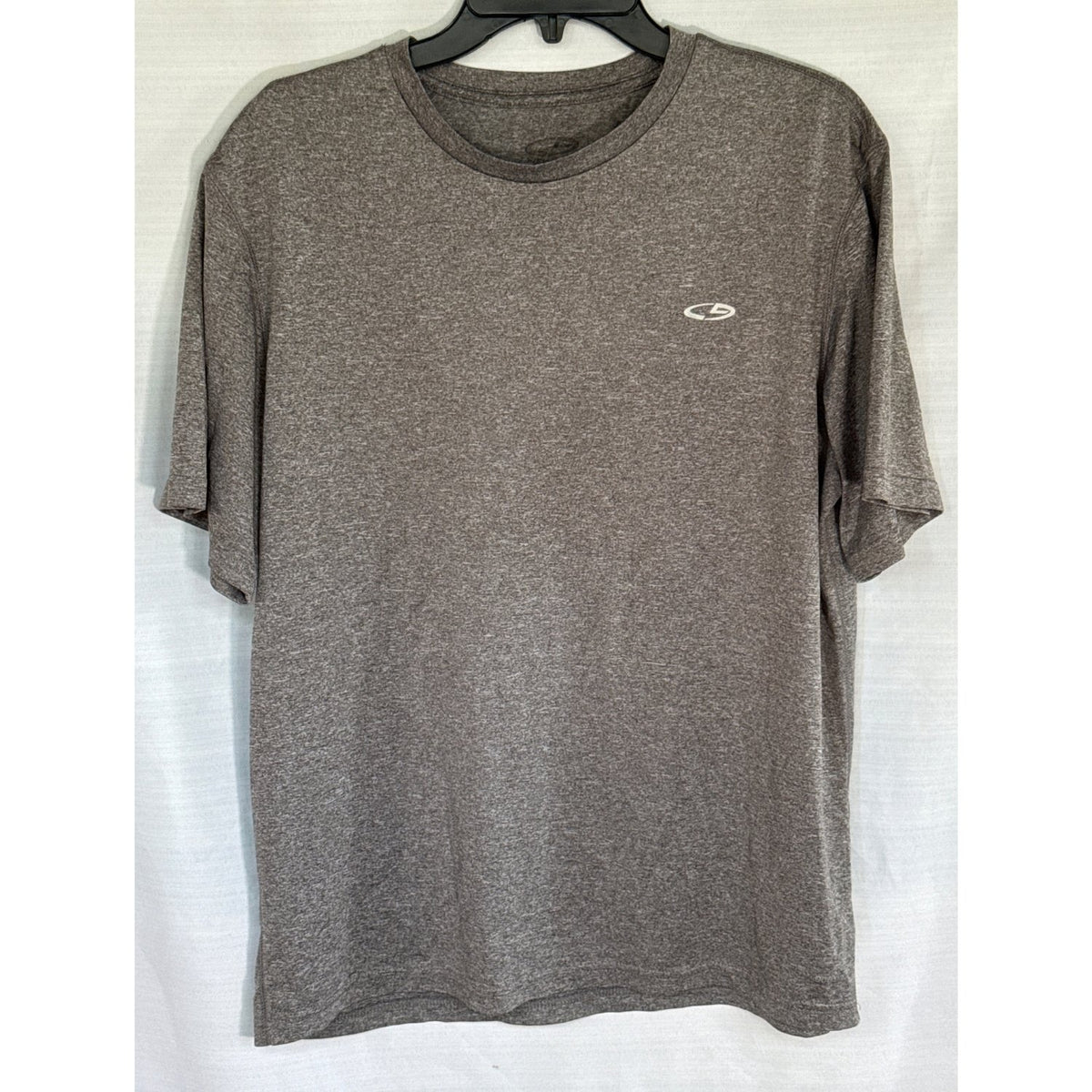 Front view of a heather gray Champion Duo Dry men’s large crewneck T-shirt with a small white chest logo.