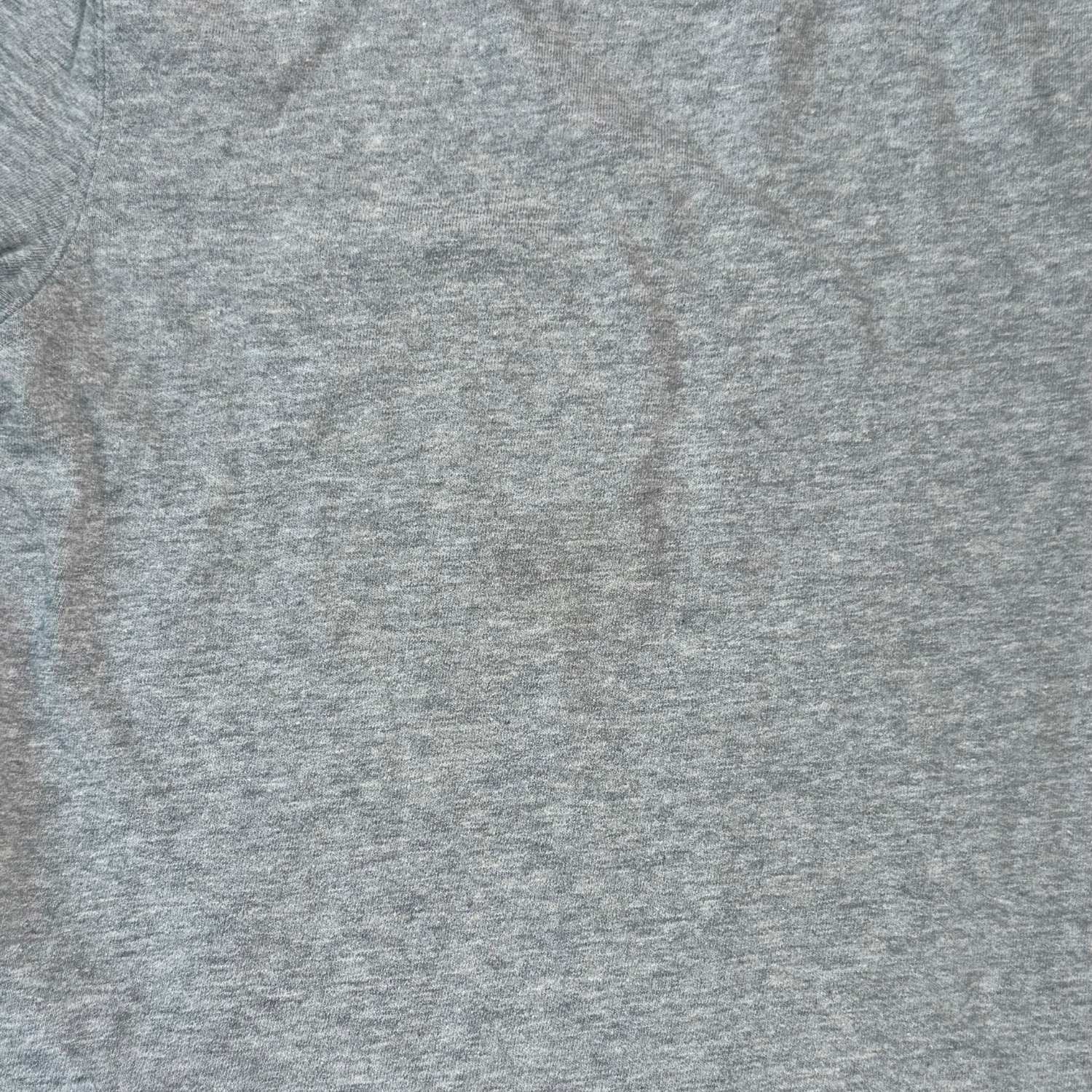 Close-up of light stain on front of Cherokee boys size 5T heather gray long sleeve shirt